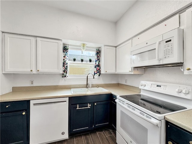 2902 Saint Joseph St Unit F, Corpus Christi, TX 78418 - kitchen with white appliances, a sink, white cabinetry, and dark wood-type flooring