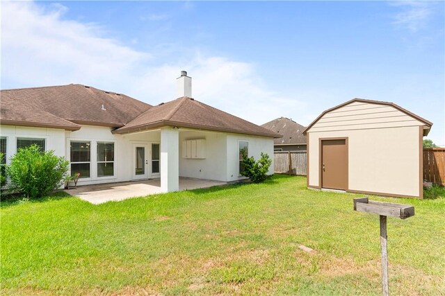 4529 Ballad Tree Dr, Corpus Christi, TX 78410 - back of property featuring a shed, a patio area, a chimney, and stucco siding