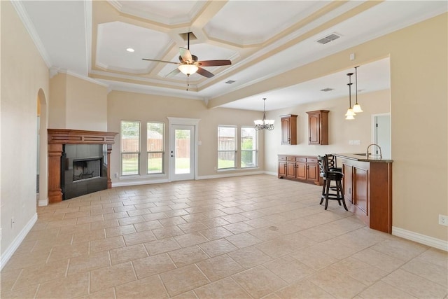 4529 Ballad Tree Dr, Corpus Christi, TX 78410 - living area featuring ceiling fan, a fireplace, a chandelier, coffered ceiling, and ornamental molding