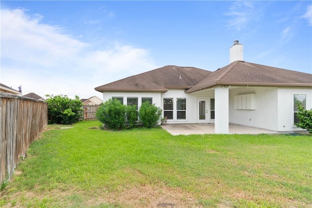 4529 Ballad Tree Dr, Corpus Christi, TX 78410 - rear view of property with stucco siding, a patio, and a chimney