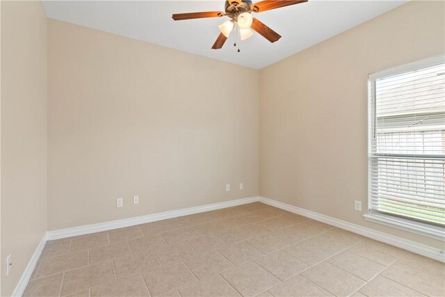 4529 Ballad Tree Dr, Corpus Christi, TX 78410 - unfurnished room featuring plenty of natural light, a ceiling fan, and light tile patterned floors