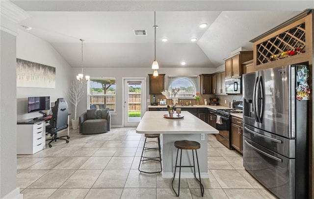 6754 Mikayla St, Corpus Christi, TX 78413 - kitchen with stainless steel refrigerator with ice dispenser, black gas range oven, lofted ceiling, light countertops, and an office area