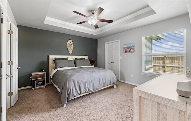6754 Mikayla St, Corpus Christi, TX 78413 - bedroom with a tray ceiling, ornamental molding, light colored carpet, baseboards, and ceiling fan