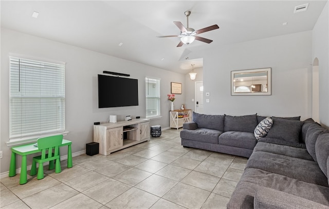 6754 Mikayla St, Corpus Christi, TX 78413 - living room with light tile patterned floors, ceiling fan, vaulted ceiling, and baseboards