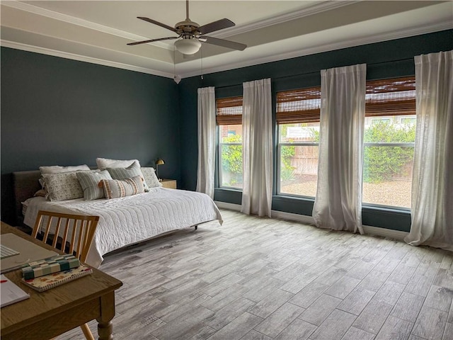 15114 Barataria Dr, Corpus Christi, TX 78418 - bedroom featuring wood finished floors, crown molding, a raised ceiling, and a ceiling fan