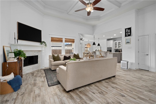 15114 Barataria Dr, Corpus Christi, TX 78418 - living room featuring a fireplace, a ceiling fan, a high ceiling, coffered ceiling, and beamed ceiling