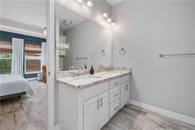 15114 Barataria Dr, Corpus Christi, TX 78418 - ensuite bathroom featuring double vanity, wood finished floors, and ceiling fan