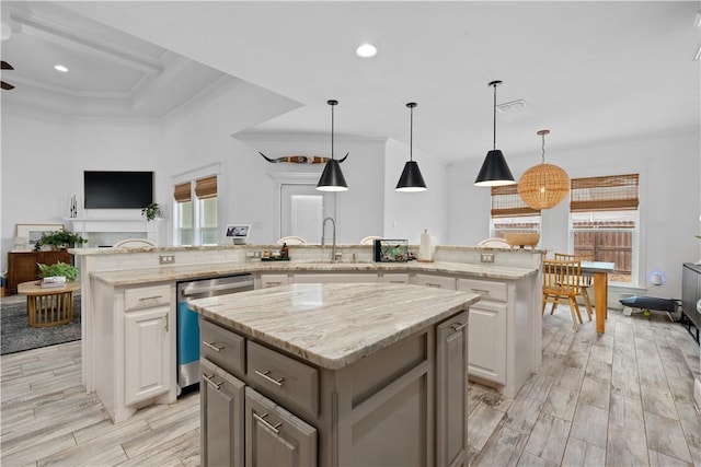 15114 Barataria Dr, Corpus Christi, TX 78418 - kitchen with dishwasher, a kitchen island, light wood-type flooring, crown molding, and recessed lighting