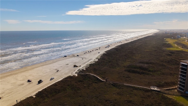 aerial view featuring a view of the beach and a water view