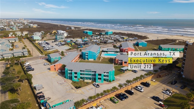 aerial view featuring a water view and a view of the beach