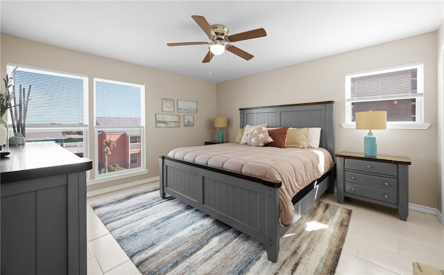 tiled bedroom with ceiling fan