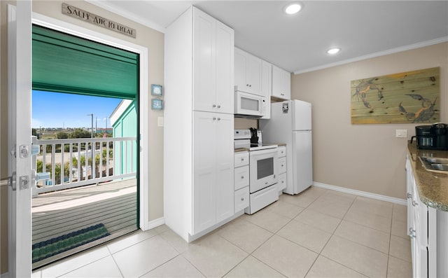 kitchen with crown molding, white cabinets, light tile patterned flooring, and white appliances