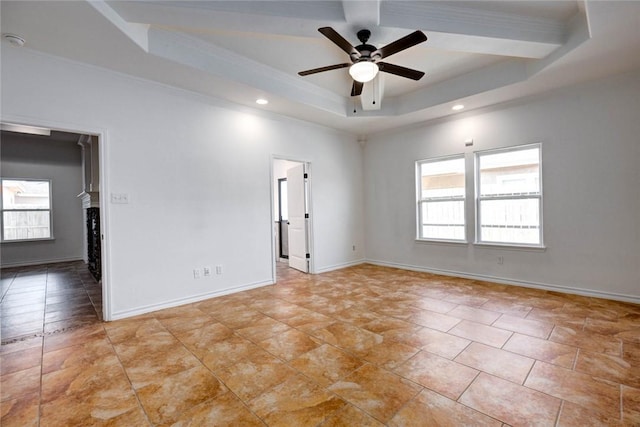 unfurnished room with crown molding, a raised ceiling, and ceiling fan