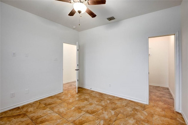 unfurnished room with ceiling fan