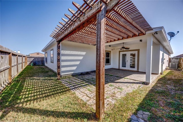 rear view of property featuring a patio, cooling unit, ceiling fan, a pergola, and french doors