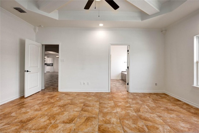 unfurnished bedroom featuring a tray ceiling, ornamental molding, and ceiling fan