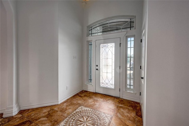 entryway with a towering ceiling