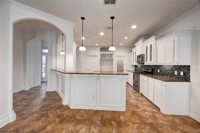 kitchen featuring decorative light fixtures, white cabinetry, decorative backsplash, ornamental molding, and stainless steel appliances