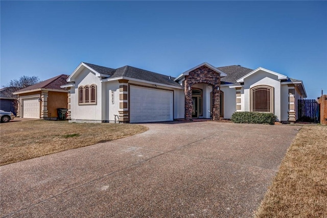 ranch-style home featuring a garage and a front yard