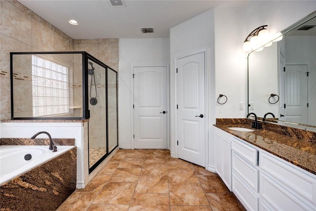 bathroom featuring vanity and separate shower and tub