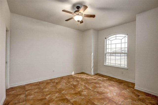 unfurnished room with ceiling fan