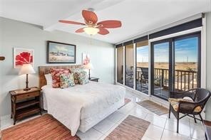 tiled bedroom featuring access to outside and ceiling fan