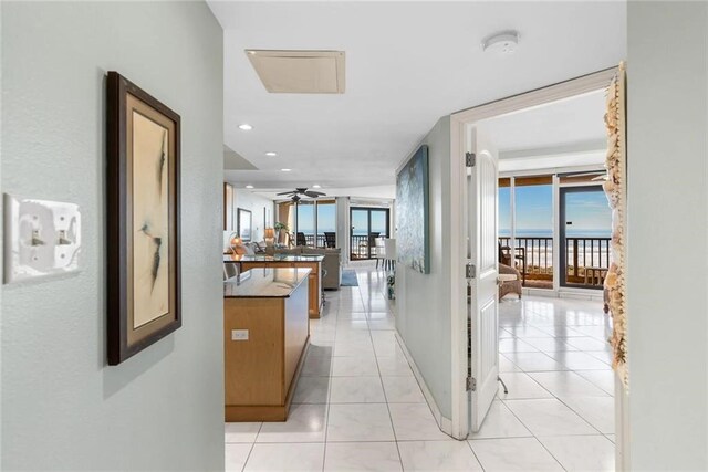 hall with light tile patterned flooring