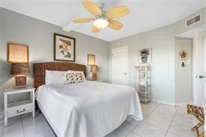 tiled bedroom with a closet and ceiling fan