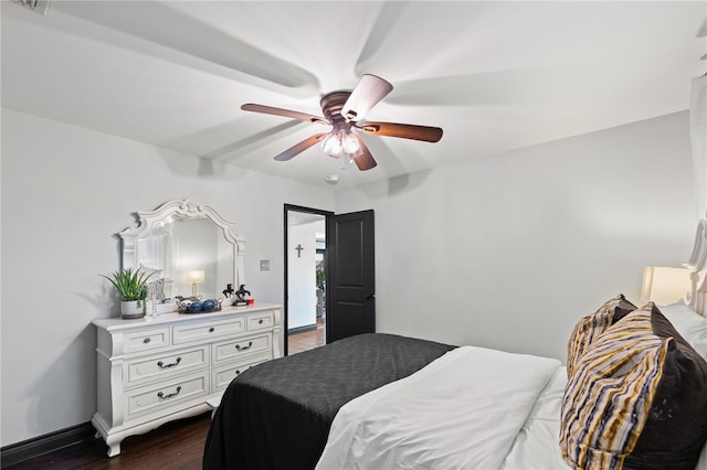 bedroom with ceiling fan and dark hardwood / wood-style floors