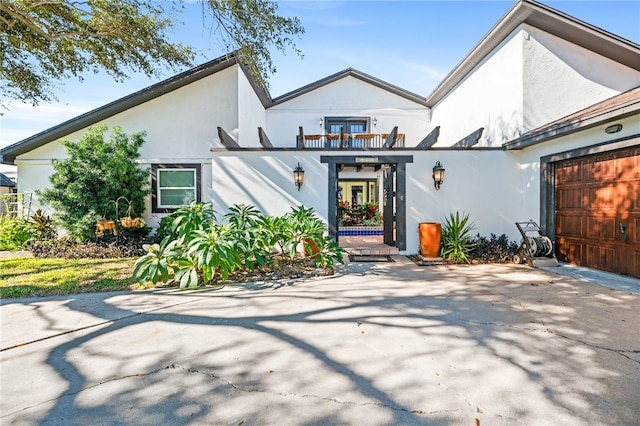 view of front of home featuring a balcony