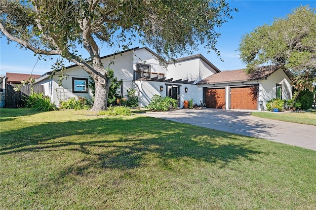 view of front of property with a garage and a front lawn