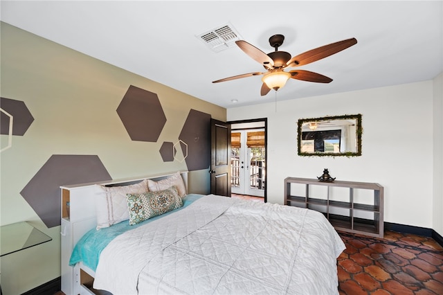 bedroom with dark tile patterned flooring, ceiling fan, and access to exterior