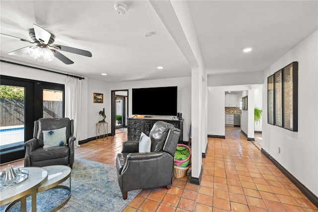 tiled living room featuring ceiling fan