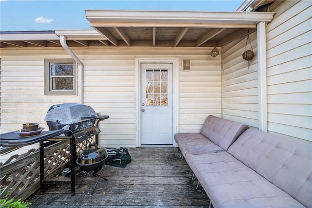 property entrance with a deck