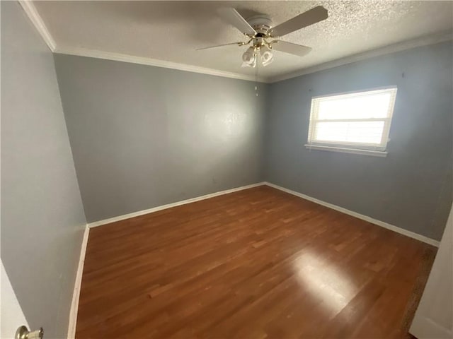 empty room with hardwood / wood-style flooring, a textured ceiling, ceiling fan, and crown molding