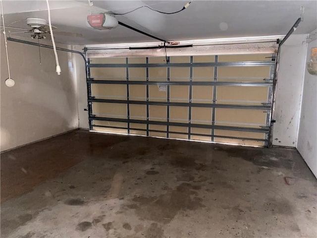 garage featuring ceiling fan and a garage door opener