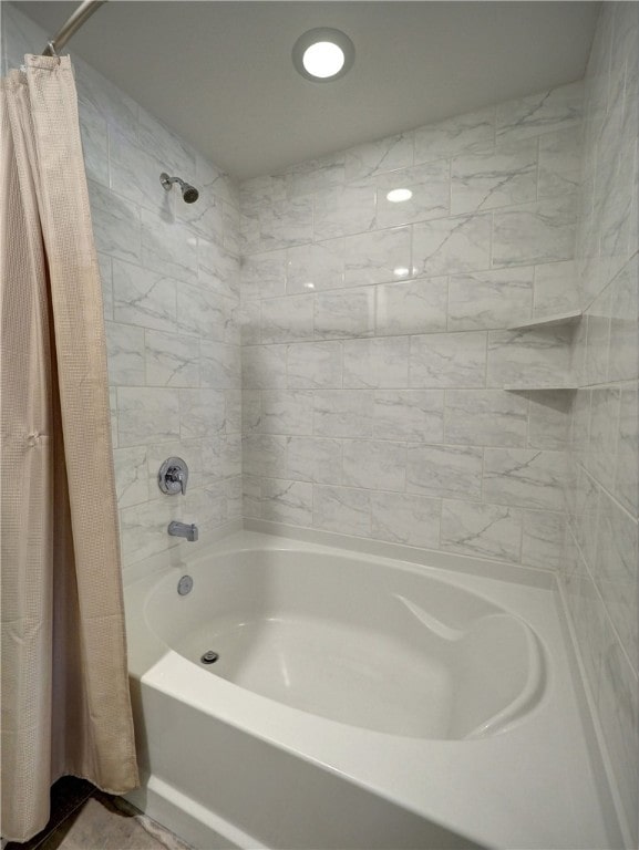 bathroom with shower / bathtub combination with curtain