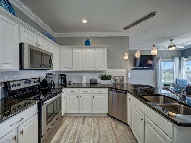 kitchen with stainless steel appliances and white cabinets