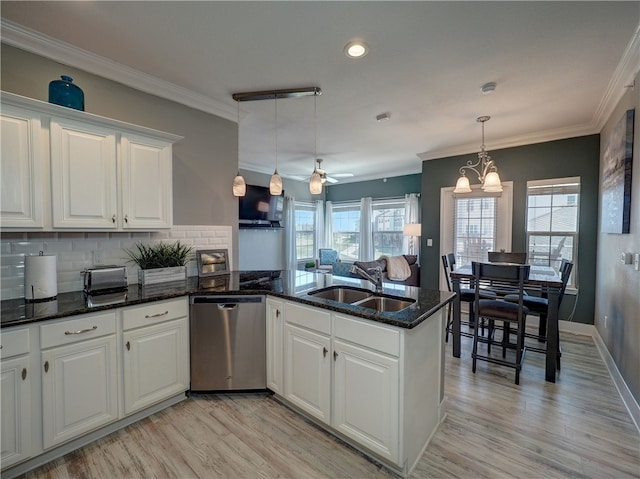 kitchen featuring white cabinetry, ceiling fan with notable chandelier, stainless steel dishwasher, and sink