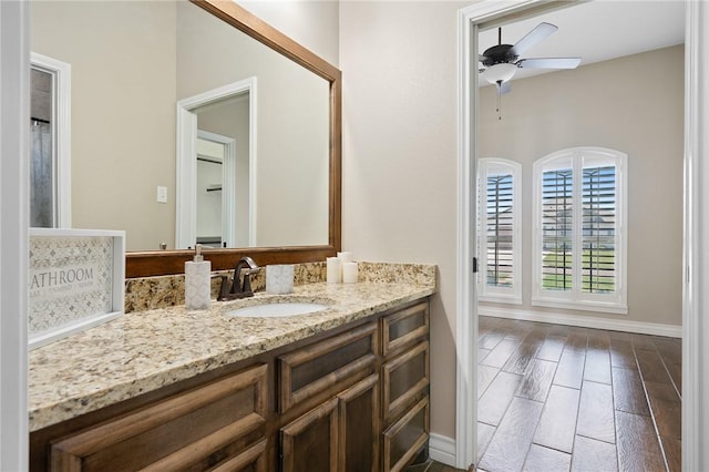 7918 Stampede Dr, Corpus Christi, TX 78414 - bathroom featuring baseboards, a ceiling fan, and vanity