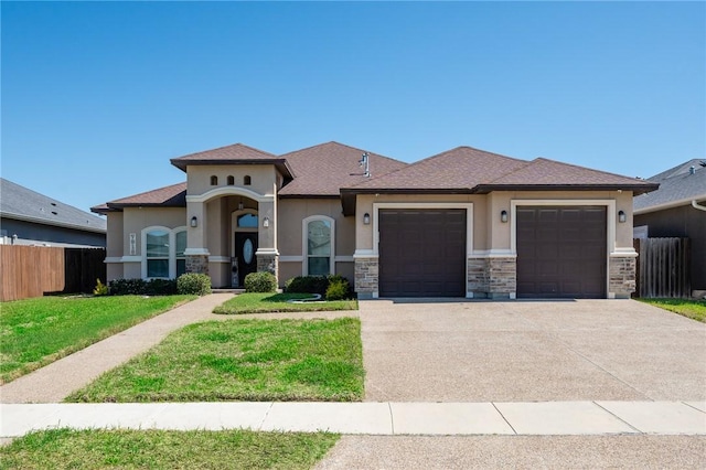 7918 Stampede Dr, Corpus Christi, TX 78414 - view of front of house with fence, a front lawn, stucco siding, driveway, and a garage