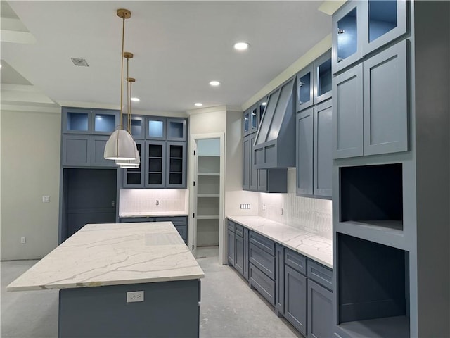 2425 Manuel, Corpus Christi, TX 78414 - kitchen featuring backsplash, a center island, recessed lighting, and glass insert cabinets