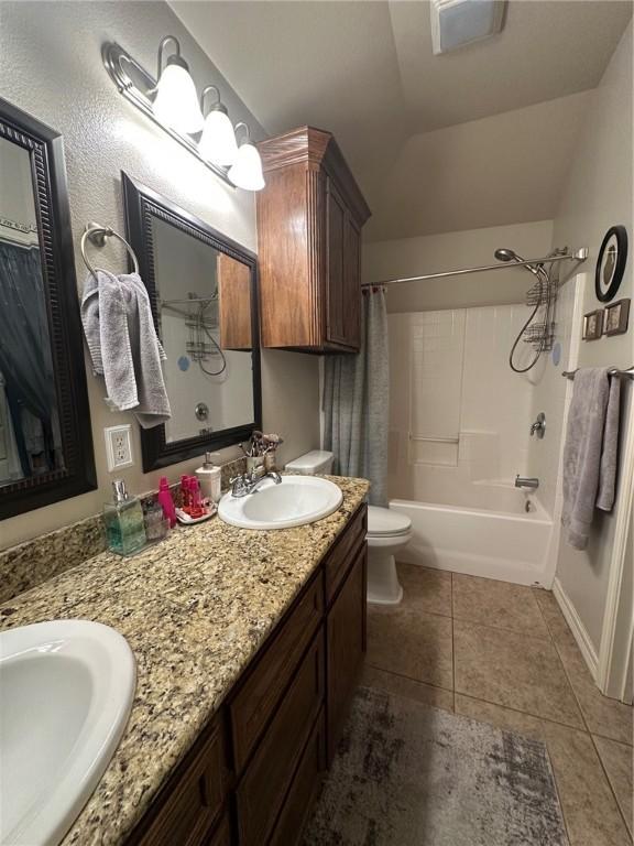 4734 Fox Trot Dr, Corpus Christi, TX 78413 - bathroom featuring a sink, tile patterned flooring, toilet, and double vanity