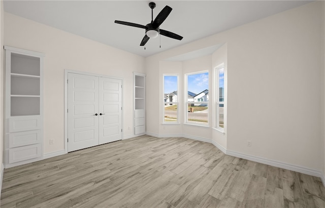 unfurnished bedroom featuring ceiling fan and light hardwood / wood-style flooring