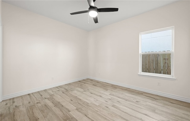 spare room with light hardwood / wood-style floors and ceiling fan