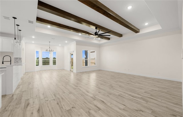 4133 Azali Dr, Corpus Christi, TX 78414 - unfurnished living room featuring a chandelier, beamed ceiling, a ceiling fan, light wood-style flooring, and recessed lighting
