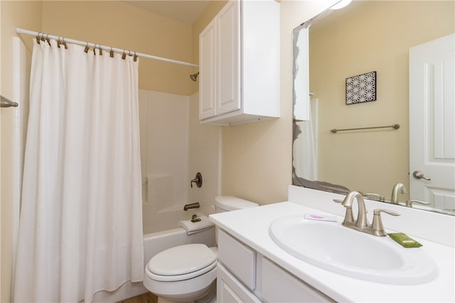 full bathroom with vanity, toilet, and shower / tub combo