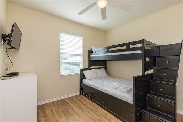 bedroom with light wood-type flooring and ceiling fan