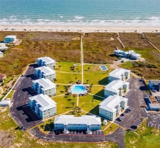 bird's eye view with a water view and a view of the beach