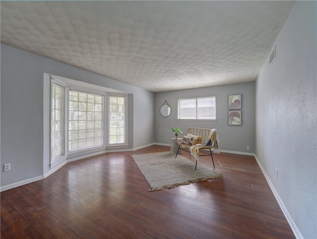 unfurnished room with dark hardwood / wood-style floors